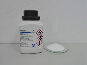 Potassium peroxydisulfate bottle and sample.jpg